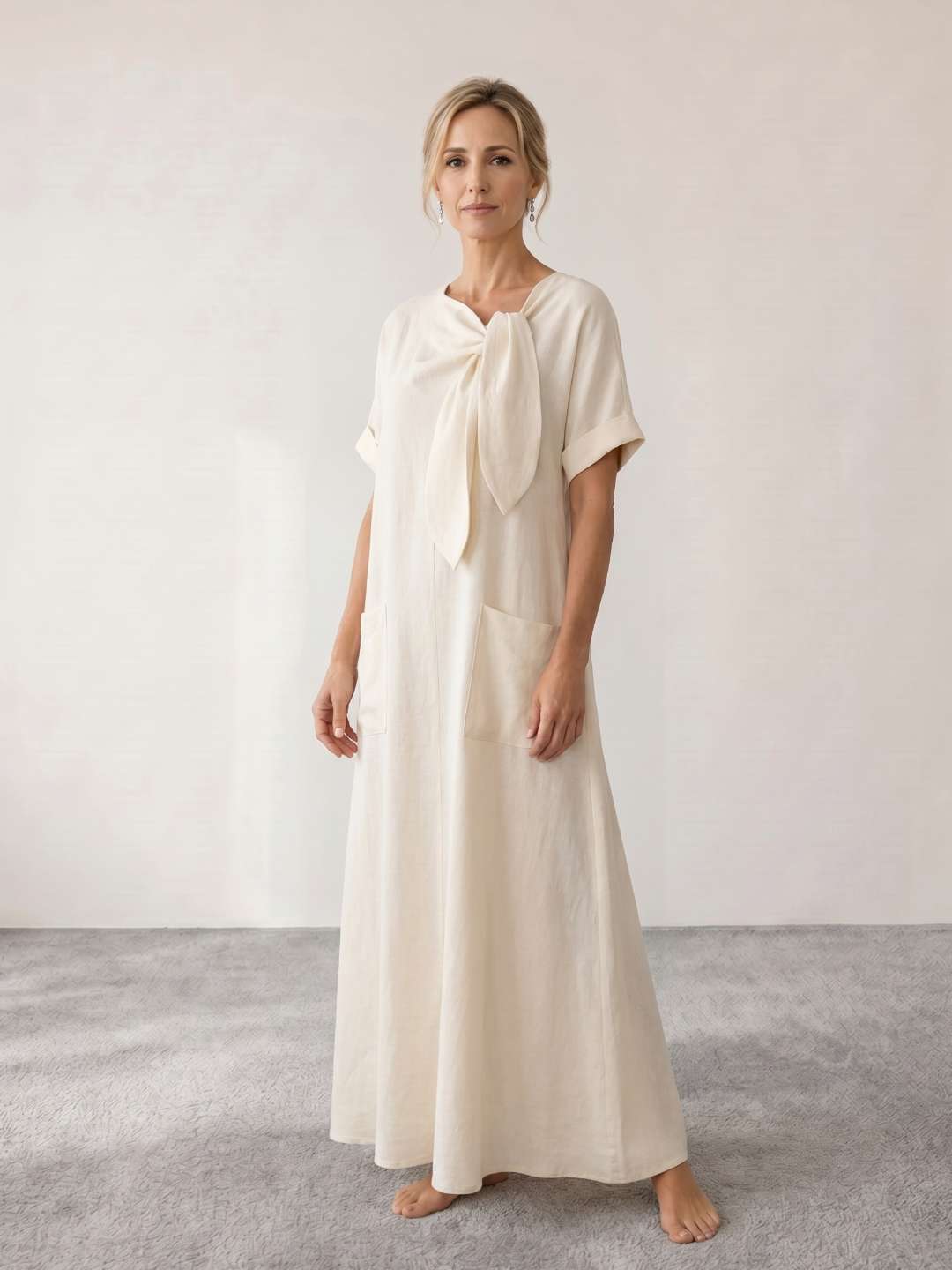 Vestido midi fluido con lazada al cuello