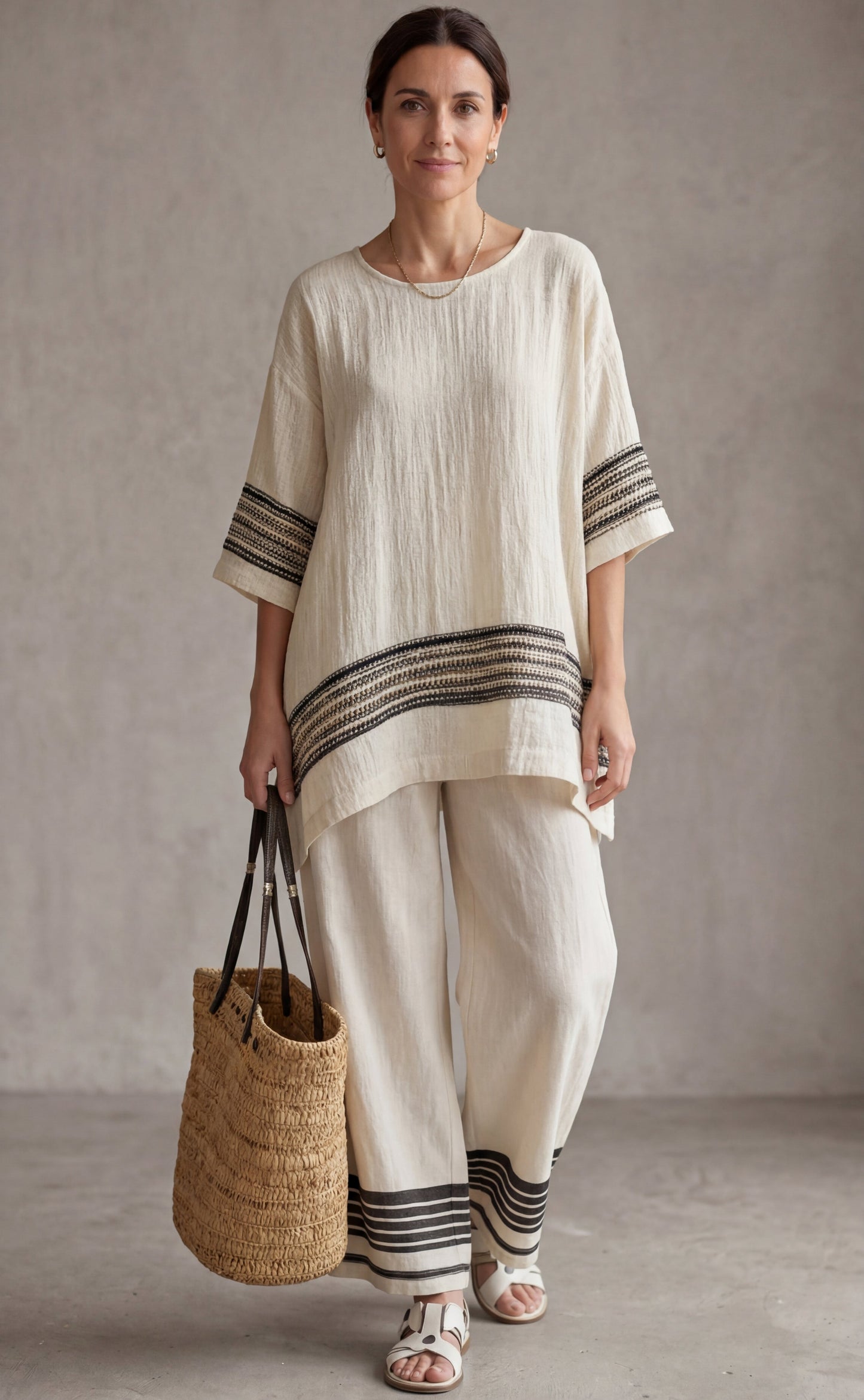 Mariella — Top elegante de lino con rayas negras y pantalones fluidos
